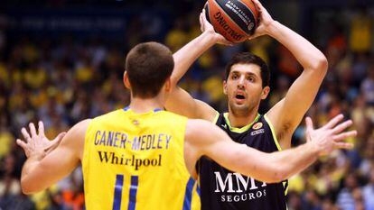 Real Madrid Nikola Mirotic&#039;s vies with Nik Caner Medley of Maccabi Electra in Tuesday&#039;s Euro League match. 