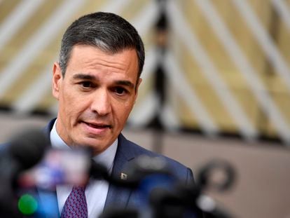 Spain's Prime Minister Pedro Sanchez speaks with the media as he arrives for an EU summit in Brussels, on October 20, 2022.