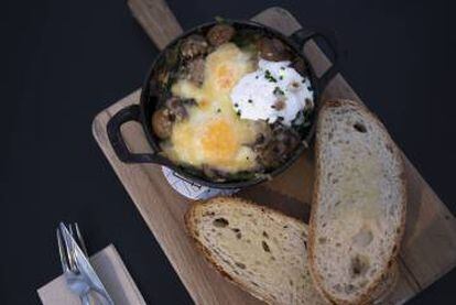 Baked free-range eggs with mushrooms at the Federal Café in Madrid.