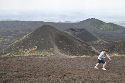 A tourist visits Mount Etna, in the Italian city of Catania.