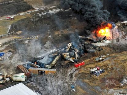 In this photo taken with a drone, portions of a Norfolk Southern freight train that derailed the previous night in East Palestine, Ohio, remain on fire at mid-day on Feb. 4, 2023.
