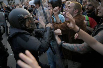 Protesters clash with police during Saturday’s protest in Barcelona.