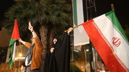 People in Tehran celebrate Iran's attack on Israel.