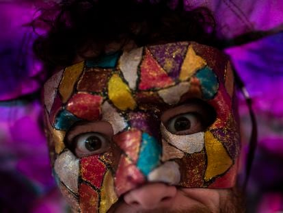 A masked reveler attends a street pre-carnival party in Rio de Janeiro on Sunday, February 12.
