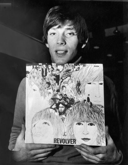 Klaus Voormann poses with the work he is best known for, the cover of The Beatles' Revolver