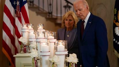 President Joe Biden, along with first lady Jill Biden, pauses at a memorial display before speaking on the one-year anniversary of the school shooting in Uvalde, Texas, at the White House, on May 24, 2023.