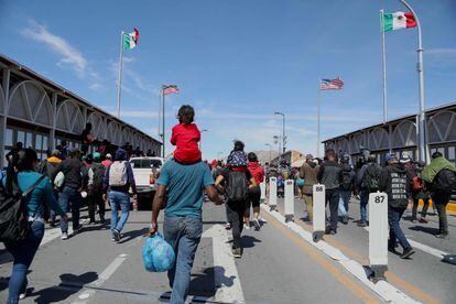 Migrants attempt to cross into the United States at the Paso del Norte International Bridge in Ciudad Juarez, Mexico, on March 12, 2023.