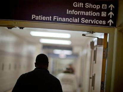 A sign points visitors toward the financial services department at a hospital, in 2014.