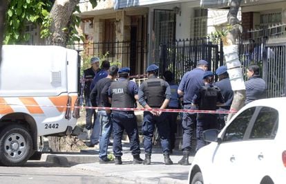 Police at the triple murder scene in Mendoza, Argentina.