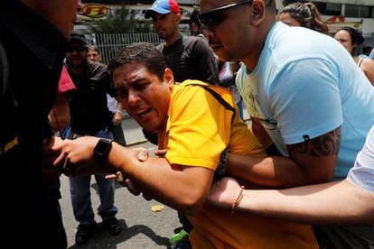 Opposition MP José Olivares (in yellow) of the Justice First party during protests on Thursday in Caracas.