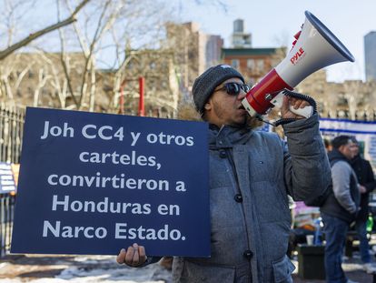 A man demonstrates in front of a federal court on the first day of the trial for Juan Orlando Hernández, on Tuesday in New York.