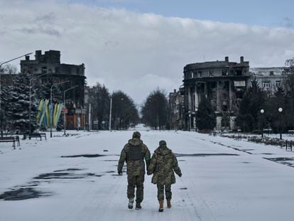 Ukrainian soldiers walk along a street in Bakhmut, Donetsk region, Ukraine, Sunday, Feb. 12, 2023.