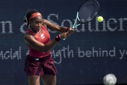 Coco Gauff, of the United States, returns a shot to Iga Swiątek, of Poland, during the semifinal of the Western & Southern Open at the Lindner Family Tennis Center.