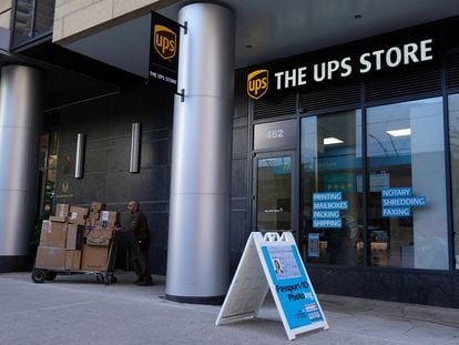 A delivery person exits a United Parcel Service (UPS) Store in Manhattan, New York City, U.S., May 9, 2022.