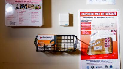 A United States Postal Service flyer about suspicious mail or packages is seen in the mail room at the King County Elections headquarters, Friday, Nov. 17, 2023, in Renton, Wash.