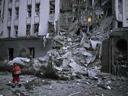 A member of the emergency services in front of a Kyiv hotel damaged by a Russian attack on December 31.