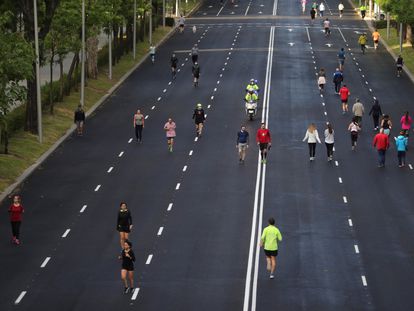 Residents of Madrid take exercise on Sunday along the city's Paseo de la Castellana thoroughfare.