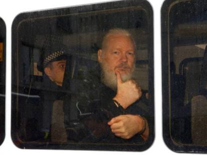 Assange in transfer after being detained in London.