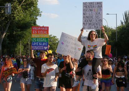 A woman at the march carries a sign reading, “I will not be free as long an LGBT+ person is not free although their chains may be very different to my own.”