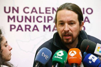 Podemos leader Pablo Iglesias talks to journalists.