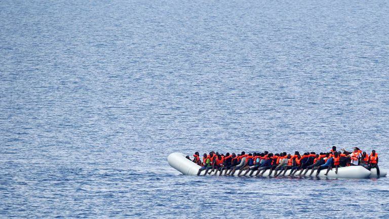 Immigrants await a rescue ship in the Mediterranean on June 18.