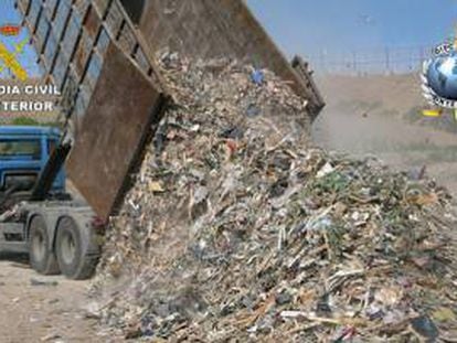 A truck dumping garbage illegally.
