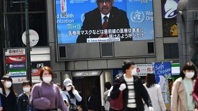 World Health Organization president Tedros Adhanom Ghebreyesus in a press conference broadcast on a screen in Japan.