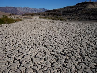 Cracked earth is visible in an area once under the water of Lake Mead at the Lake Mead National Recreation Area, on January 27, 2023, near Boulder City, Nevada.