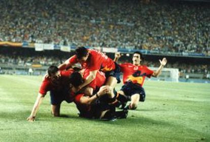 Players from Spain's soccer team celebrate a goal against Poland. Their 3-2 win saw them take gold.