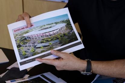 Jorge Mas holds the 'render' of the new Inter Miami stadium.