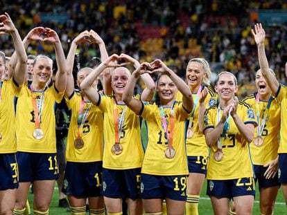 Sweden players celebrate after finishing in third place.