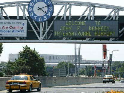 A clock at the entrance to JFK Airport in New York is pictured on Aug. 15, 2003.