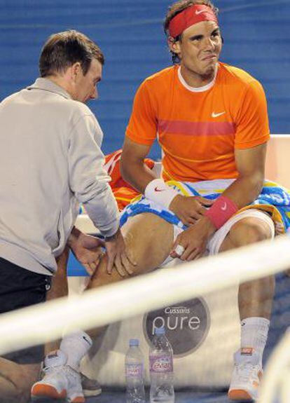 Rafael Nadal receives treatment on his knee during the 2010 Australia Open.