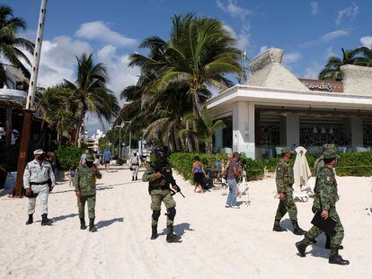 Security forces patrol outside the Mamita's Beach Club after assailants killed a bar manager, in Playa del Carmen.