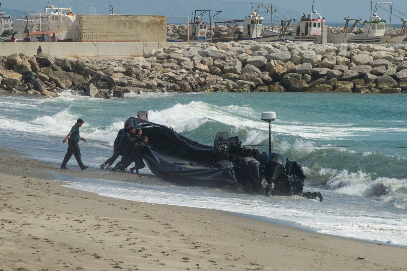 The Civil Guard with an abandoned narco-vessel following a chase along El Tonelero beach in La Atunara. 