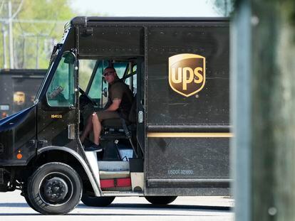 A UPS truck makes deliveries in Northbrook, Ill