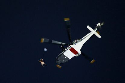 Parachuting. Stunt doubles for the queen and actor Daniel Craig jump out of a helicopter over London’s Olympic Stadium for the opening ceremony of the 2012 Games.
