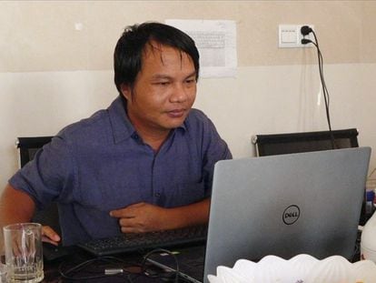 Myanmar photojournalist Sai Zaw Thaike is seen working in this undated photo.