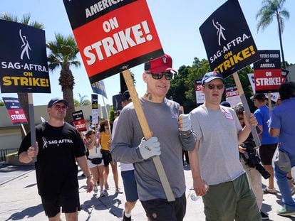 Actor Bob Odenkirk, center, carries a sign on a picket line outside Paramount studios on Wednesday, July 19, 2023, in Los Angeles.