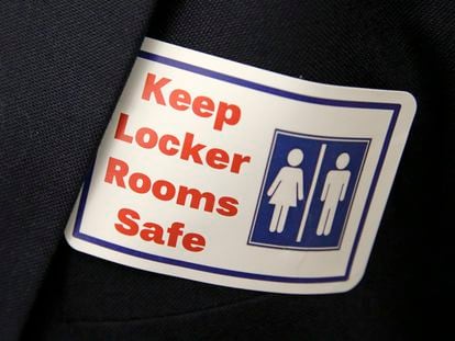 A sticker that reads, "Keep Locker Rooms Safe," is worn by a person supporting a bill that would eliminate Washington's rule allowing transgender people use gender-segregated bathrooms and locker rooms in public buildings consistent with their gender identity, on Jan. 27, 2016, at the Capitol in Olympia, Wash.