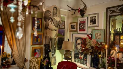 A life-size photograph of Michael Henry Adams’ father playing basketball dominates the room, alongside Barack Obama and a photo of Martin Luther King taken by Adams’ grandfather (above, right).