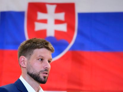 Leader of Progressive Slovakia party Michal Simecka prepares to cast his vote at a polling station during an early parliamentary election in Bratislava, Slovakia, Saturday, Sept. 30, 2023.