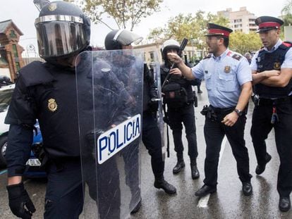 Catalan police and riot officers argue during the October 1 referendum.