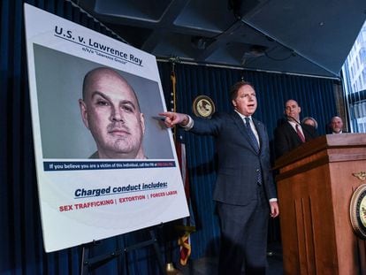 In this file photo taken on February 11, 2020, US Attorney for the Southern District of New York, Geoffrey Berman (C), announces the indictment against Lawrence Ray aka "Lawrence Grecco in New York City.