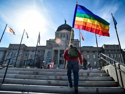 Demonstrators gather on the steps of the Montana state Capitol protesting anti-LGBTQ+ legislation in Helena, Mont