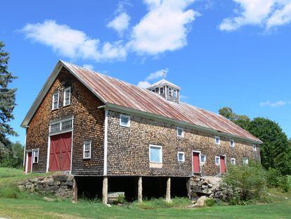 A late 19th century Maine barn with a second story, basement and cupola for ventilation.