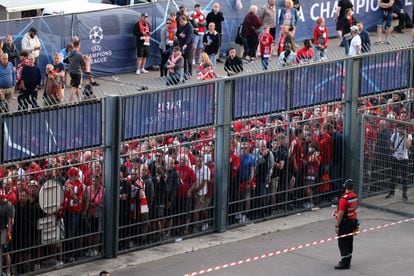 In this file photo taken on May 28, 2022, Liverpool fans stand outside unable to get in time leading to the match being delayed prior to the UEFA Champions League final football match between Liverpool and Real Madrid at the Stade de France in Saint-Denis, north of Paris.