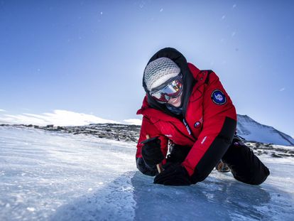 Glaciologist Veronica Tollenaar, taking samples on an area of blue ice on the Ellsworth Mountains.