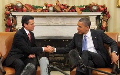 Obama and then President-elect Peña Nieto shake hands during a meeting at the White House in 2012.