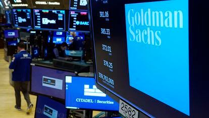 FILE - The logo for Goldman Sachs appears above a trading post on the floor of the New York Stock Exchange on July 13, 2021. Goldman Sachs has agreed Monday, May 8, 2023, to pay $215 million to settle a years-long class action lawsuit that claimed the bank discriminated against women when it came to pay, performance evaluations and promotions. (AP Photo/Richard Drew, File)